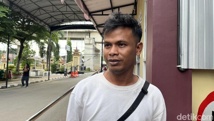 1765818368172-rio-chaniago-saat-melaporkan-kasus-penipuan-gadai-motor-di-polrestabes-palembang-1765815166443_169